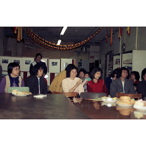 Audience and refreshments at a meeting between Mexican workers and the Chinese Progressive Association