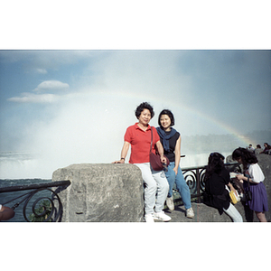 Lydia Lowe and another woman sit in front of Horseshoe Falls during a visit to Niagara Falls