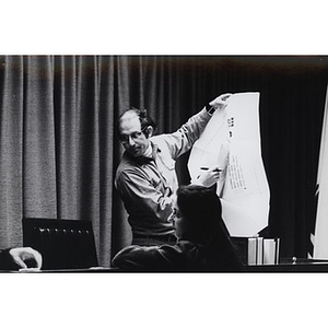 School of Law Professor Stephen Subrin holding an oversize document