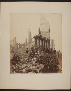 Group of men stand in the ruins of the Boston fire, 1872