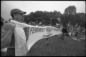Men holding a large banner for the Feminist Majority Foundation: 2004 March for Women's Lives