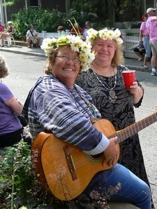 Parade watchers with a guitar and red Solo cup : Provincetown Carnival parade