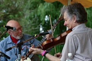 Pete Seeger (banjo) and Mike Seeger (fiddle), performing on stage at the Clearwater Festival