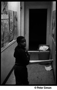 Young boy in a hallway: Liberation School, Boston, Mass.