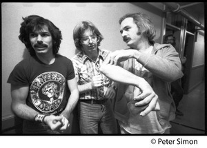 Grateful Dead backstage (left to right): Mickey Hart, Phil Lesh, and Bill Kreutzman