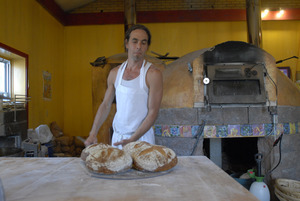 Hungry Ghost Bread: owner and baker Jonathan C. Stevens with fresh-baked bread