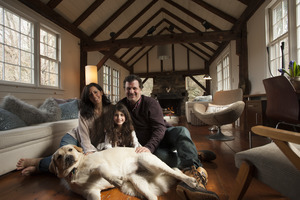 Sheffield House: Martin Canellakis, Faith Cromas, daughter Eva, and dog Poppy in their living room, Sheffield, Mass.