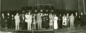 W. E. B. Du Bois on stage with large group of Chinese dignitaries