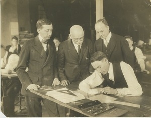 Mr. Will Hays, Mr. Pollock, and Mr. Monroe watch Earl Ingersoll drafting at the Institute for Crippled and Disabled Men