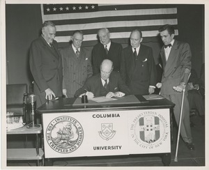 Richard C. Hunt signing an agreement at the Columbia University and Presbyterian Hospital affilation ceremony