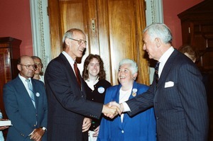 Congressman John W. Olver (left) shaking hands with Tom Foley (right) after swearing-in as U.S. Representative for the 1st District, Massachusetts