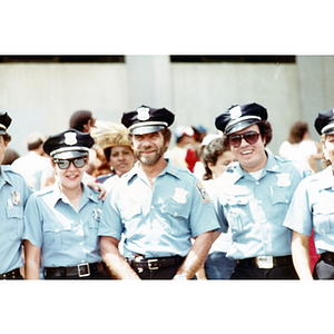 Police officers in uniform smile during the Festival Puertorriqueño