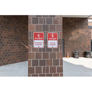 Harriet Tubman House parking lot signs on column