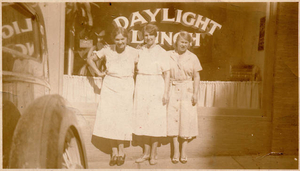 Three women in front of Daylight Lunch