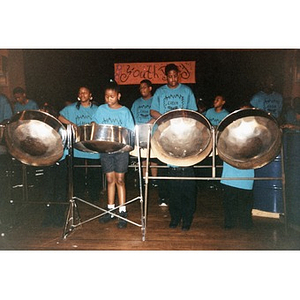 African American youth playing steel drums on stage at the Jorge Hernandez Cultural Center.
