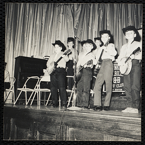 The Banjo Stars of Bunker Hillbillies playing on the stage at a Boys' Club event