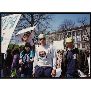 Jerry Steimel, Charlestown Clubhouse director, at right, and an unidentified man looking at the camera while walking in the Boys and Girls Clubs of Boston 100th Anniversary Celebration Parade