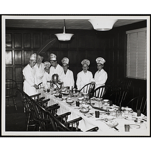 Members of the Tom Pappas Chefs' Club set a table with Chef's Club Committee member Mary A. Sciacca