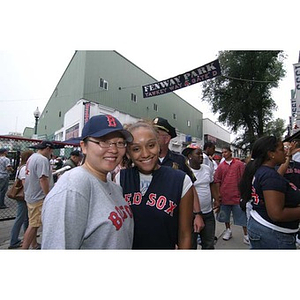 Qinrui Pang and Melanie Arvajo pose together outside Fenway Park