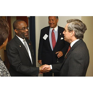 Richard Freeland greets Joseph Feaster at The National Council Dinner