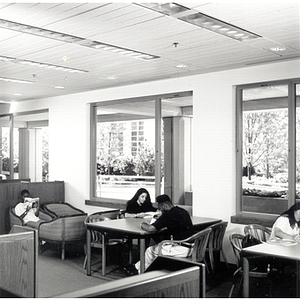 Students studying at a table in Snell Library