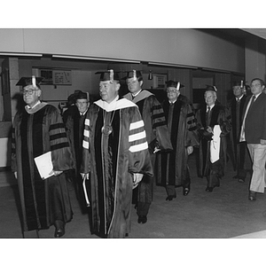 President Ryder leads a group of honorary degree recipients and speakers at commencement