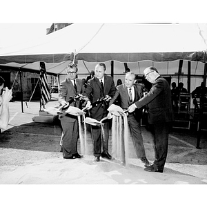 President Knowles and three others with shovels at the Law School groundbreaking