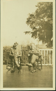 Arthur Lyman and Kenneth Parson, Jr., seated on Bonney Hall Plantation porch, S.C.