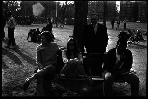 Crowd on Cambridge Common: people seated on a park bench