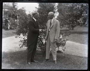 Gov. Alvan Fuller shaking hands with Henry Ford (l. to r.)