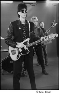The Cars filming 'You Might Think': (l-r) Ric Ocasek, Benjamin Orr, and Greg Hawkes performing in front of a green screen