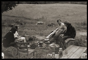 Relaxing outside the house, in conversation, Montague Farm commune