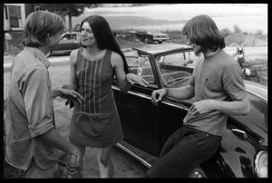 James 'Lazarus' Tapley, Cathy Rogers, and Whit Garberson in front of a Volkswagen Beetle, Montague Farm Commune
