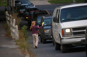 Protest against a pornographic video store in Northampton: protester handing out fliers to cars on North Street