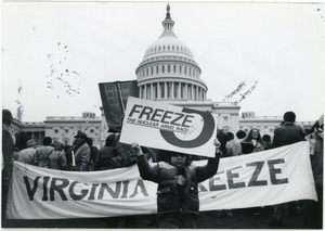 Francesco Saviano holding up a sign for the nuclear freeze at a protest in from the U.S. Capitol building