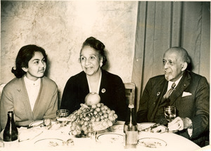W. E. B. Du Bois, Shirley Graham Du Bois, and unidentified woman at dinner