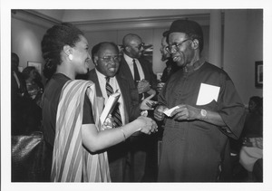 Chinua Achebe and Malaika Adero at a reception