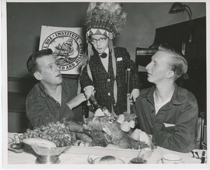 Young client wearing headdress and carving turkey