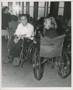 Wheelchair users talking on main deck of boat