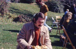 Dick Whiting carrying a plate of food