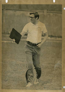 Ken Klatka walking with clipboard