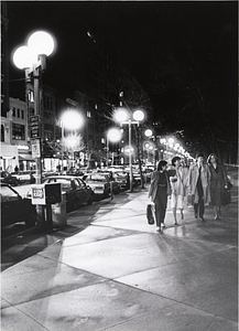 Four unidentified people on a Back Bay street at night