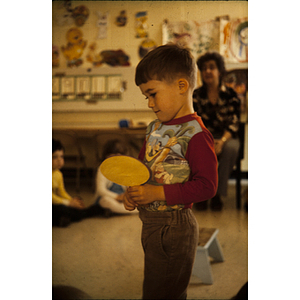 Boy holding a paddle