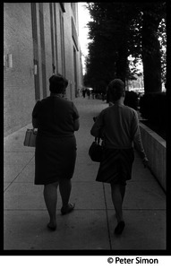 Women walking along the sidewalk, Boston University
