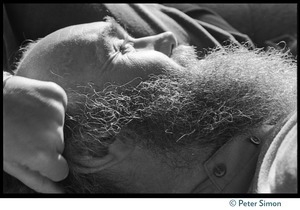Close-up of a sleeping Ram Dass on a couch