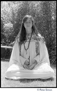 Dolma: full-length portrait, seated in lotus position, meditating, with bhairava mudra