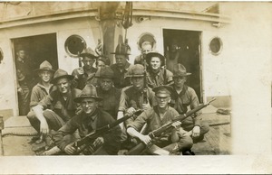 Ignacy Skarpetowski and fellow members of 1st Co., Coast Artillery Corps: posed with rifles aboard ship