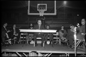 John W. Lederle (President, UMass Amherst) responds to questions at open meeting with school administration, Curry Hicks Cage, regarding protests against war in Vietnam