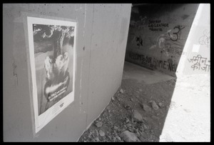Antinuclear poster and graffiti on concrete underpass at Nevada Test Site peace encampment