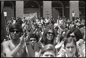 Demonstration at State House against the killings at Kent State: crowd on State House steps holding up banner "Millionaires profit"